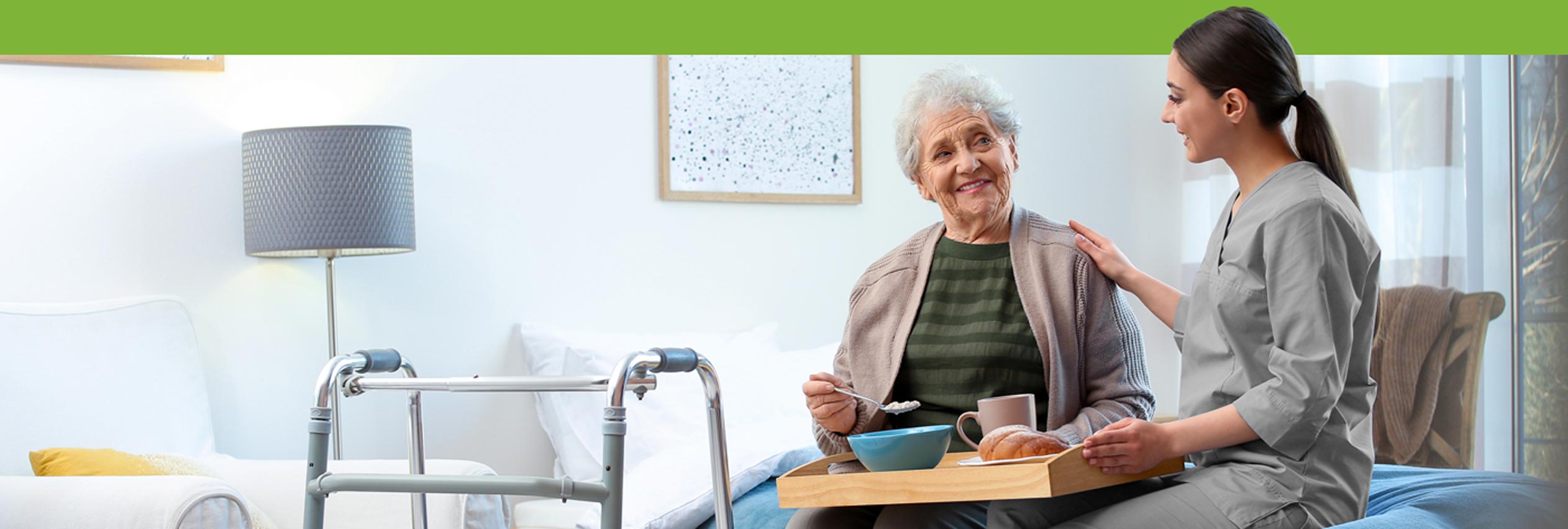 KD Care Services carer sitting and talking with an elderly lady